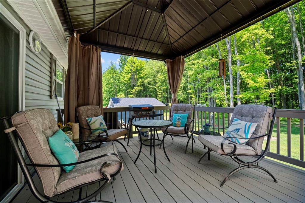 73 South Summit Road, Unit 510 Greenville, PA 16125 - Photo 28 of 33 a view of a patio with table and chairs and wooden floor