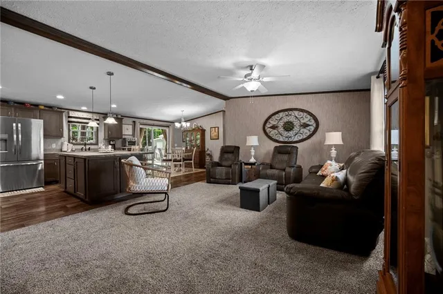a living room with lots of furniture and lots of wooden floors