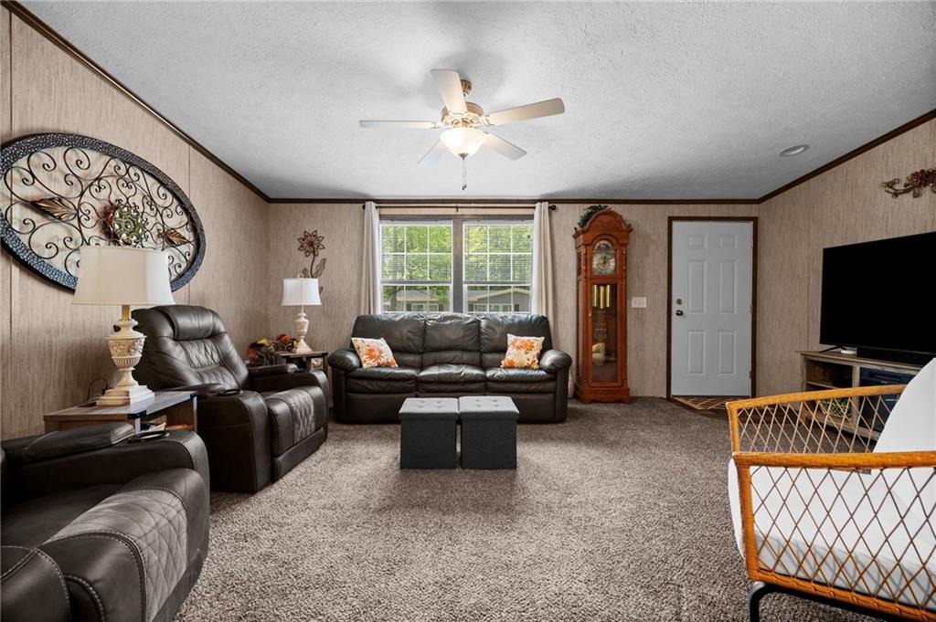 73 South Summit Road, Unit 510 Greenville, PA 16125 - Photo 6 of 33 a living room with furniture and a flat screen tv