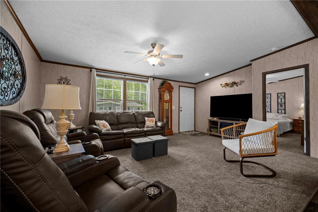 73 South Summit Road, Unit 510 Greenville, PA 16125 - Photo 7 of 33 a living room with furniture and a flat screen tv