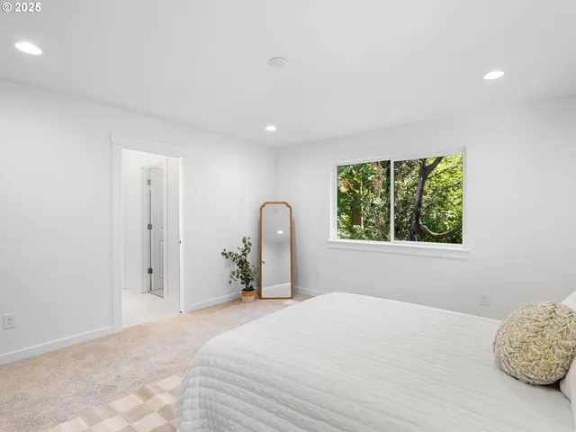 a spacious bathroom with a granite countertop sink mirror and double