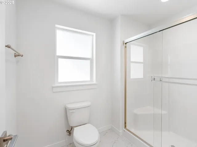 a view of a deck with wooden floor and fence