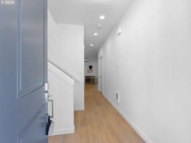 a view of a hallway with the wooden floor