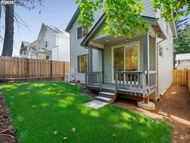 a backyard of a house with lots of green space