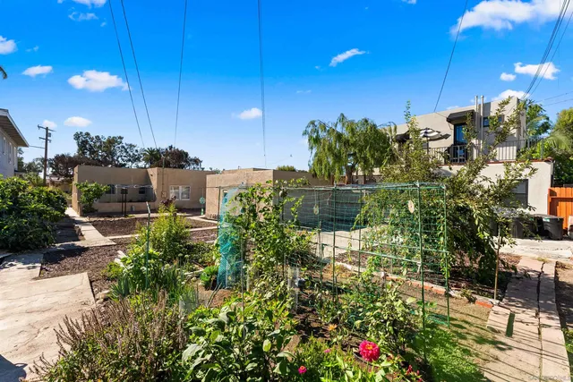 a view of a patio with table and chairs potted plants
