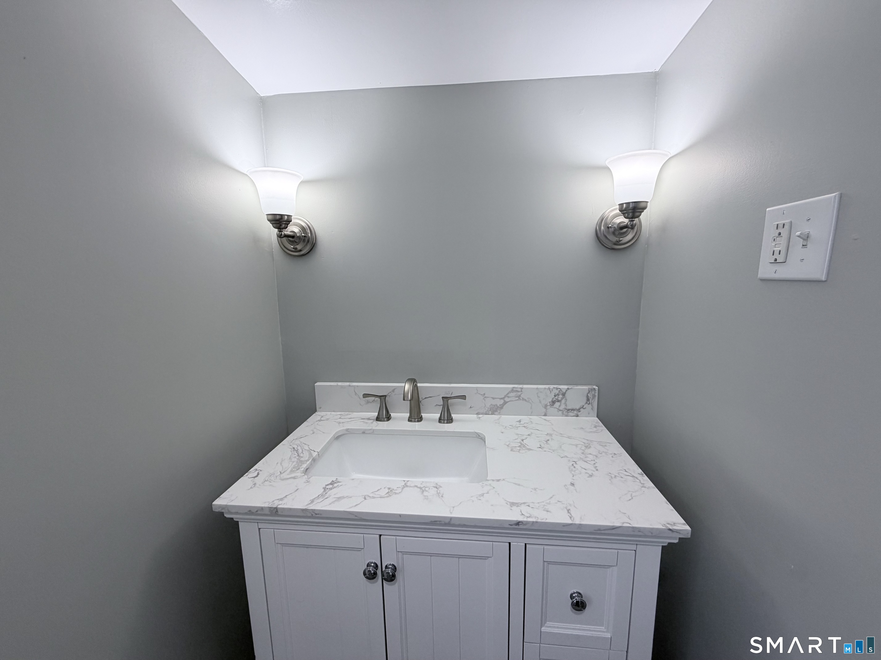 141 Starr Hill Road Groton, CT 06340 - Photo 15 of 31 a bathroom with a sink and vanity