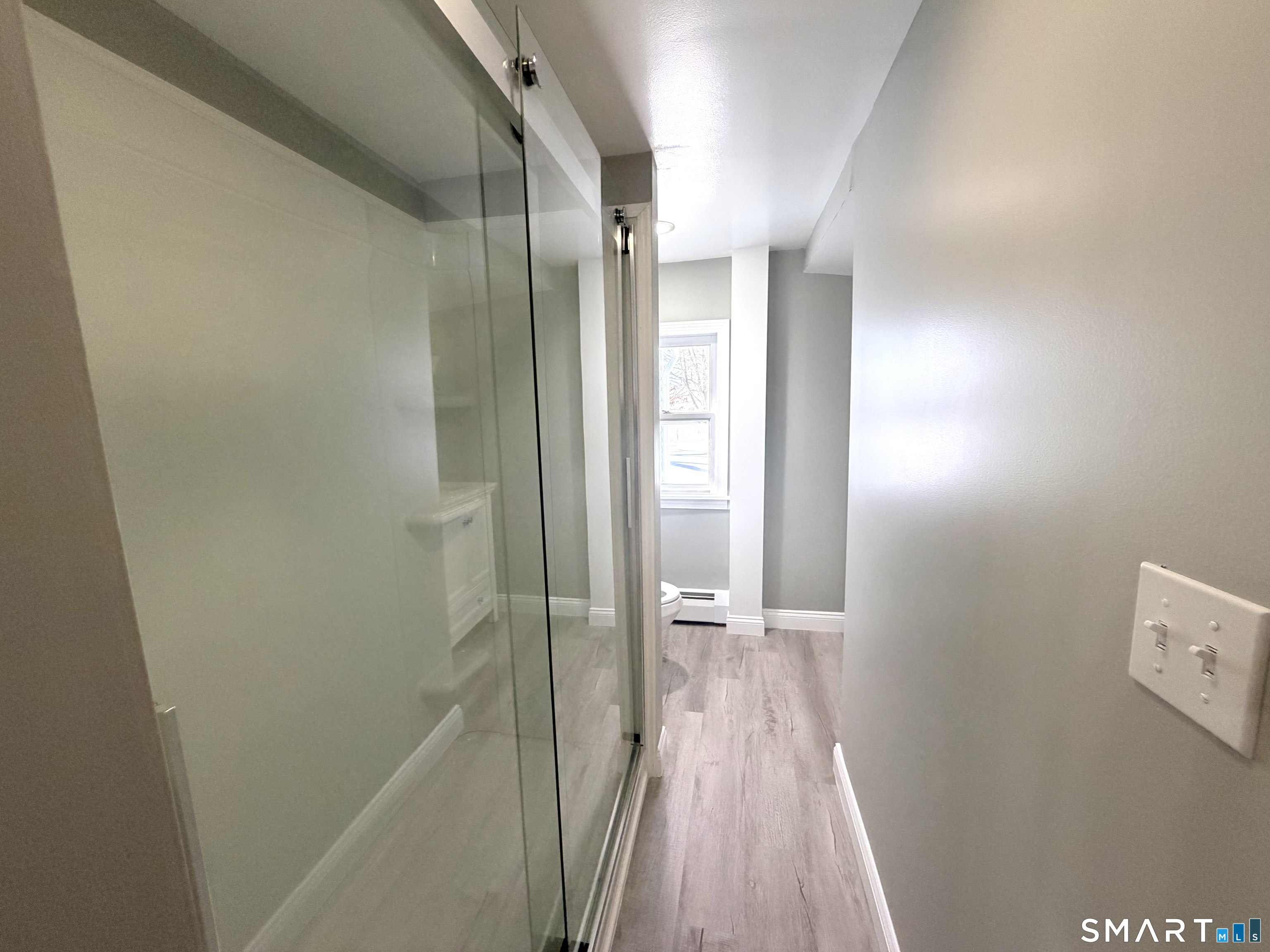 141 Starr Hill Road Groton, CT 06340 - Photo 16 of 31 a bathroom with a glass shower door