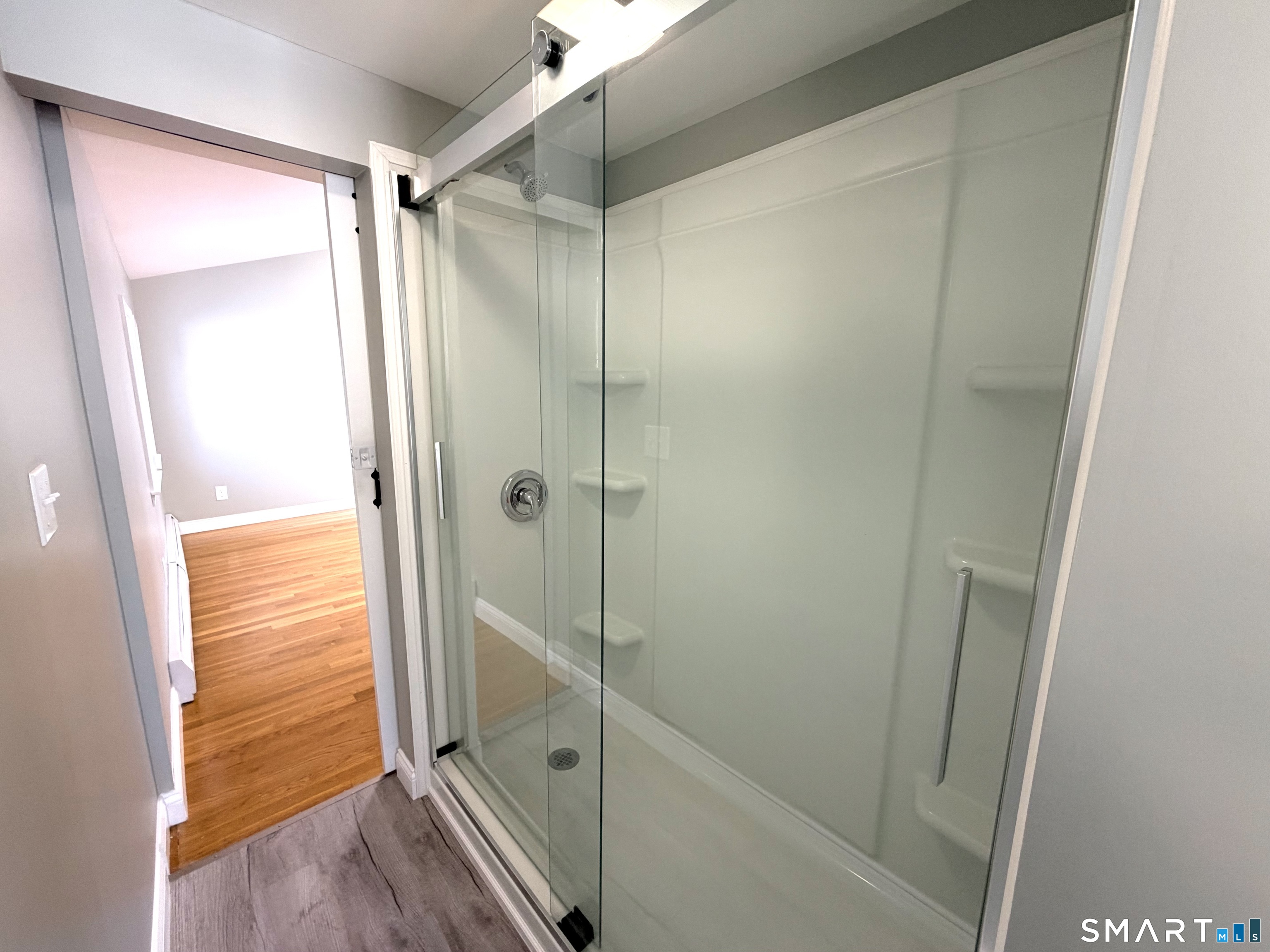 141 Starr Hill Road Groton, CT 06340 - Photo 17 of 31 a bathroom with a glass shower door