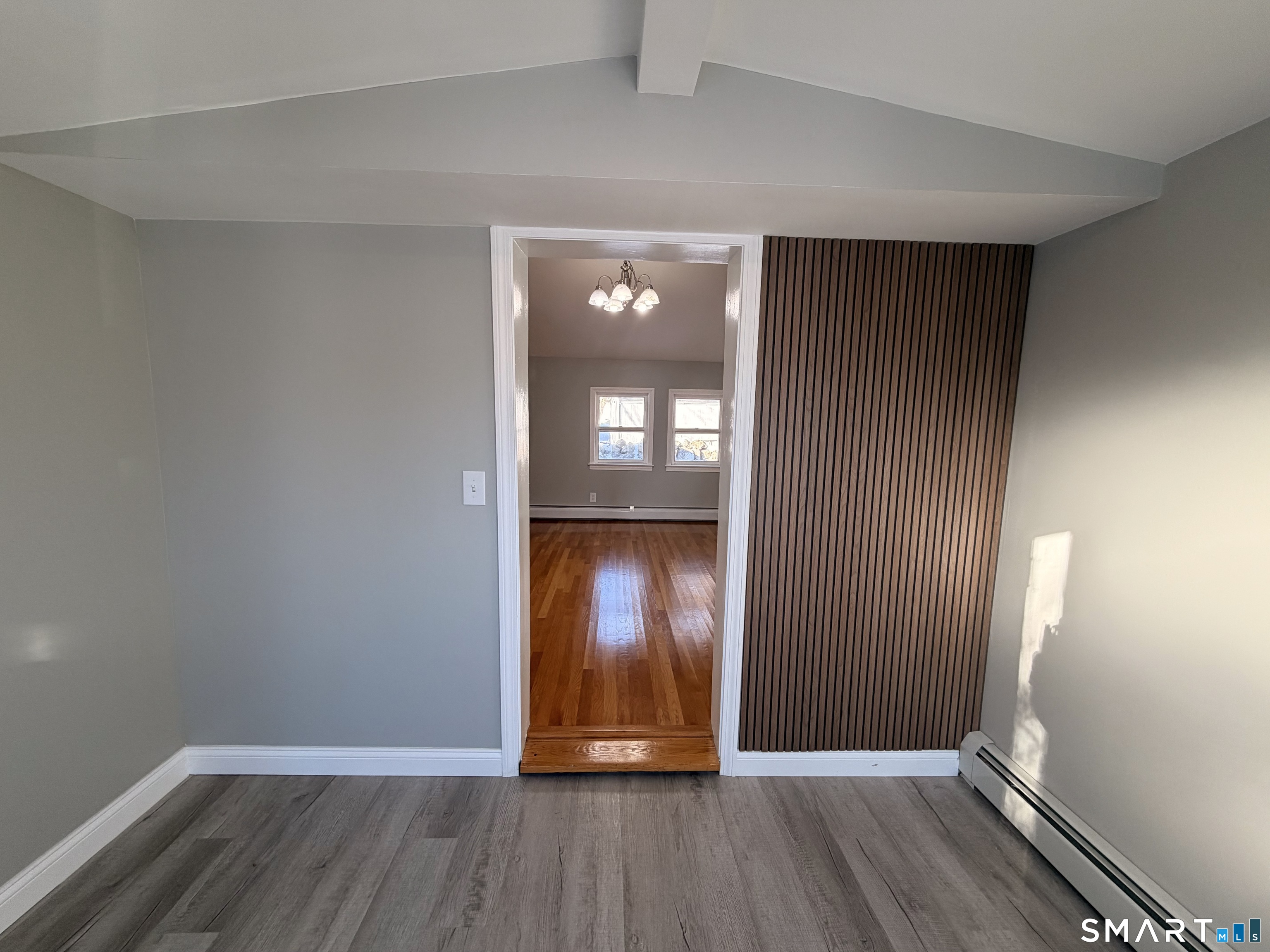 141 Starr Hill Road Groton, CT 06340 - Photo 2 of 31 an empty room with wooden floor and windows