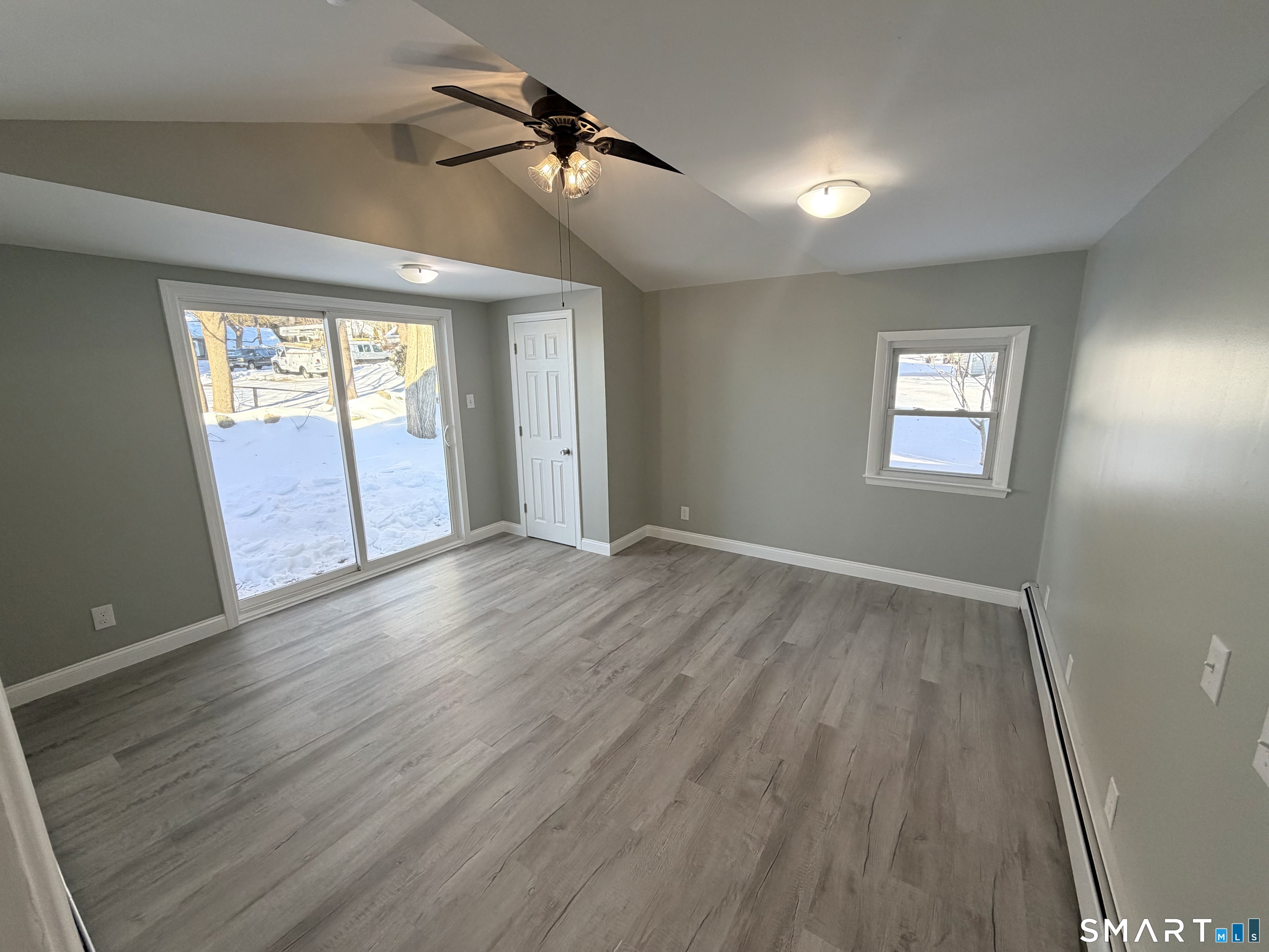 141 Starr Hill Road Groton, CT 06340 - Photo 22 of 31 a view of empty room with wooden floor and fan