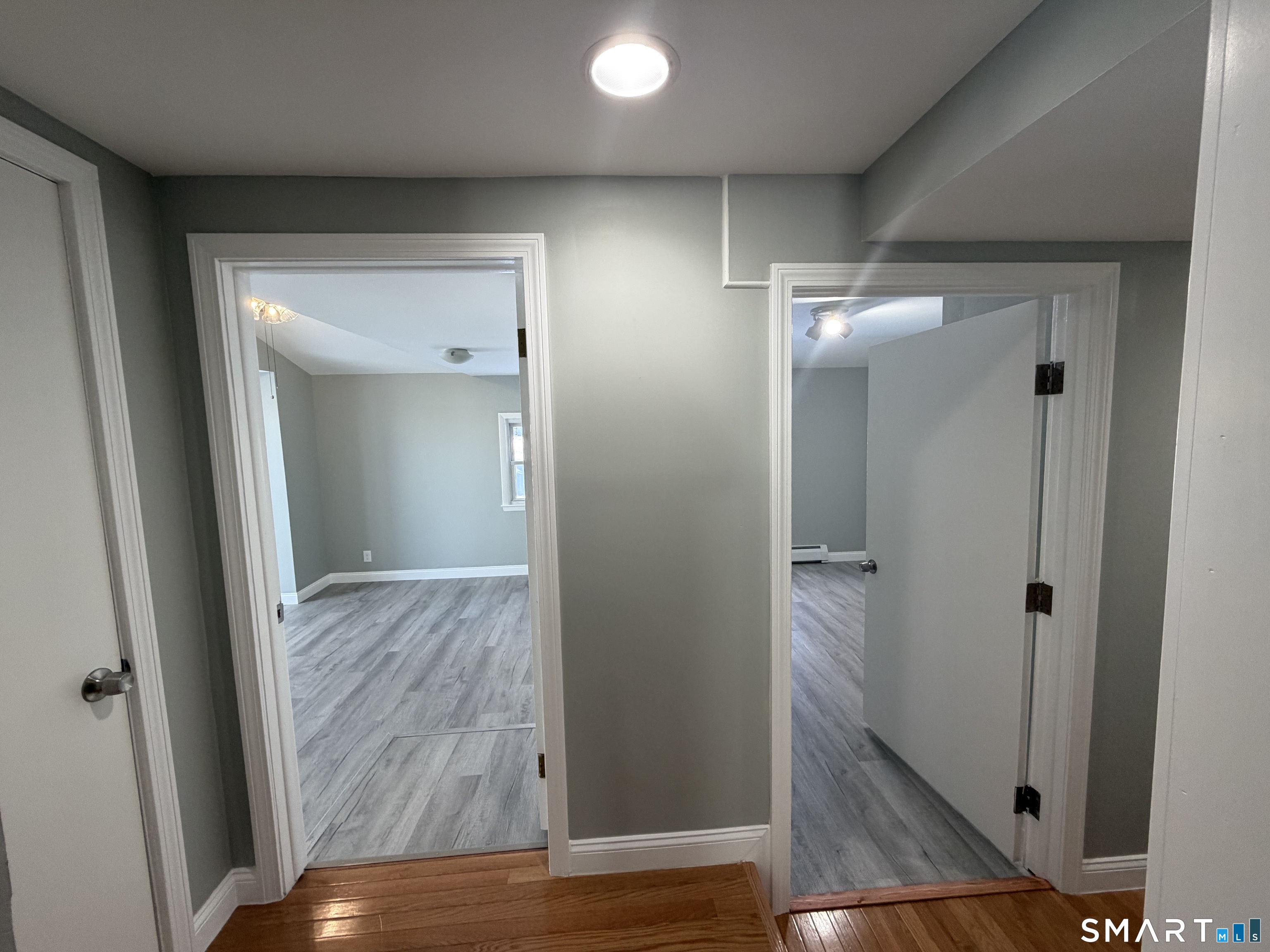 141 Starr Hill Road Groton, CT 06340 - Photo 24 of 31 wooden floor in a mirror