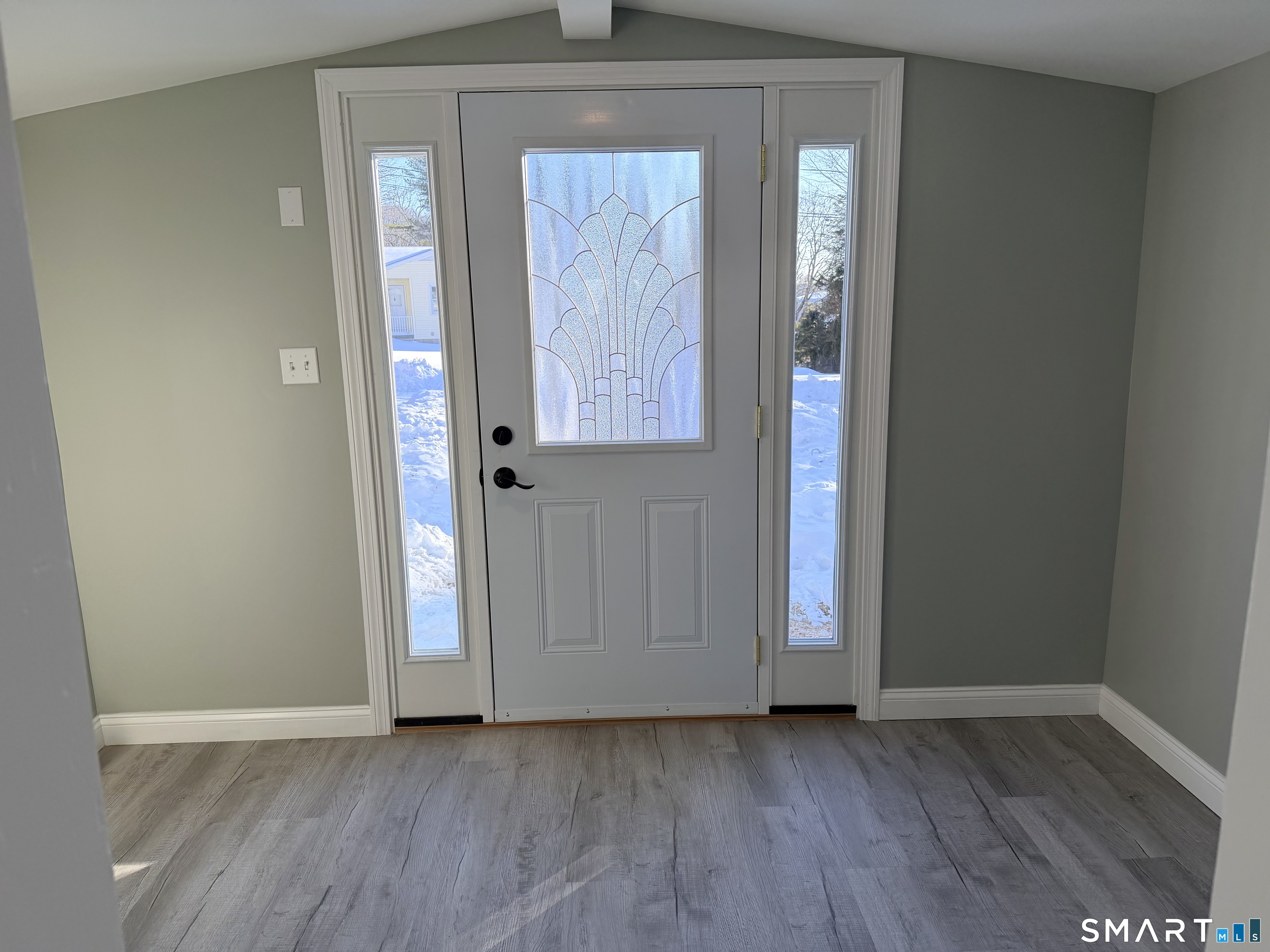 141 Starr Hill Road Groton, CT 06340 - Photo 3 of 31 an empty room with wooden floor and windows