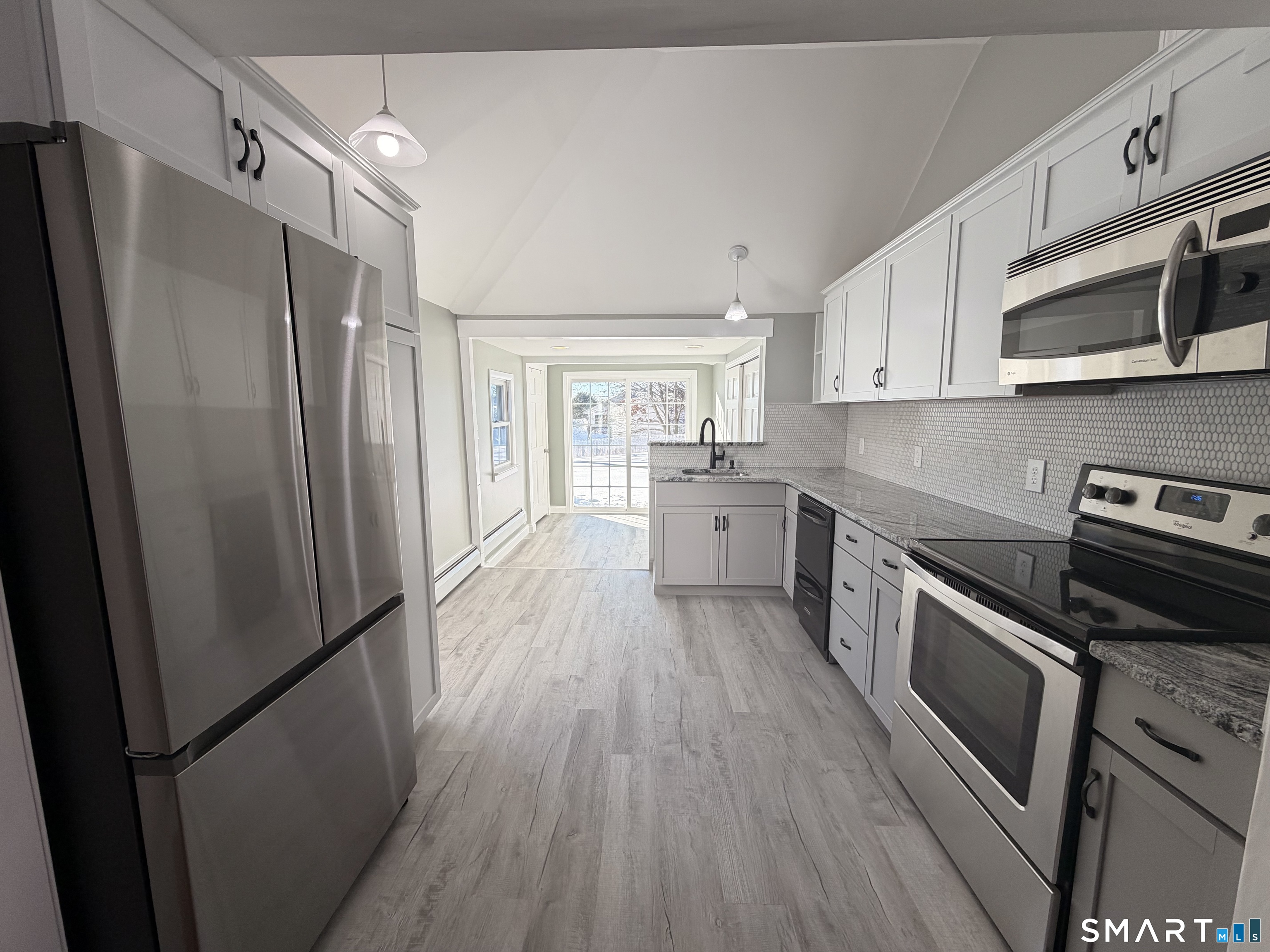 141 Starr Hill Road Groton, CT 06340 - Photo 6 of 31 a kitchen with stainless steel appliances a refrigerator sink and microwave