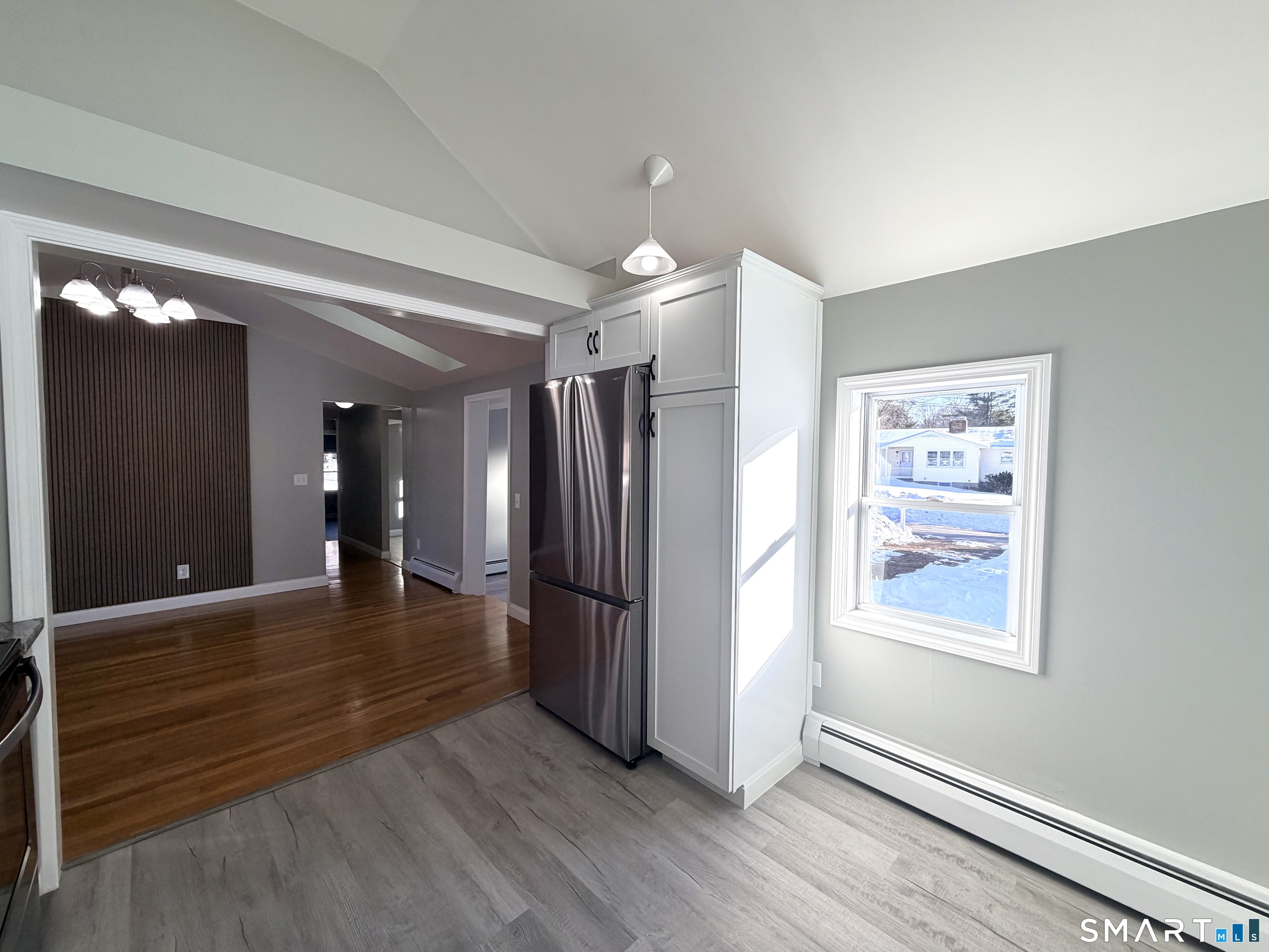 141 Starr Hill Road Groton, CT 06340 - Photo 7 of 31 a view of a hallway with wooden floor and staircase