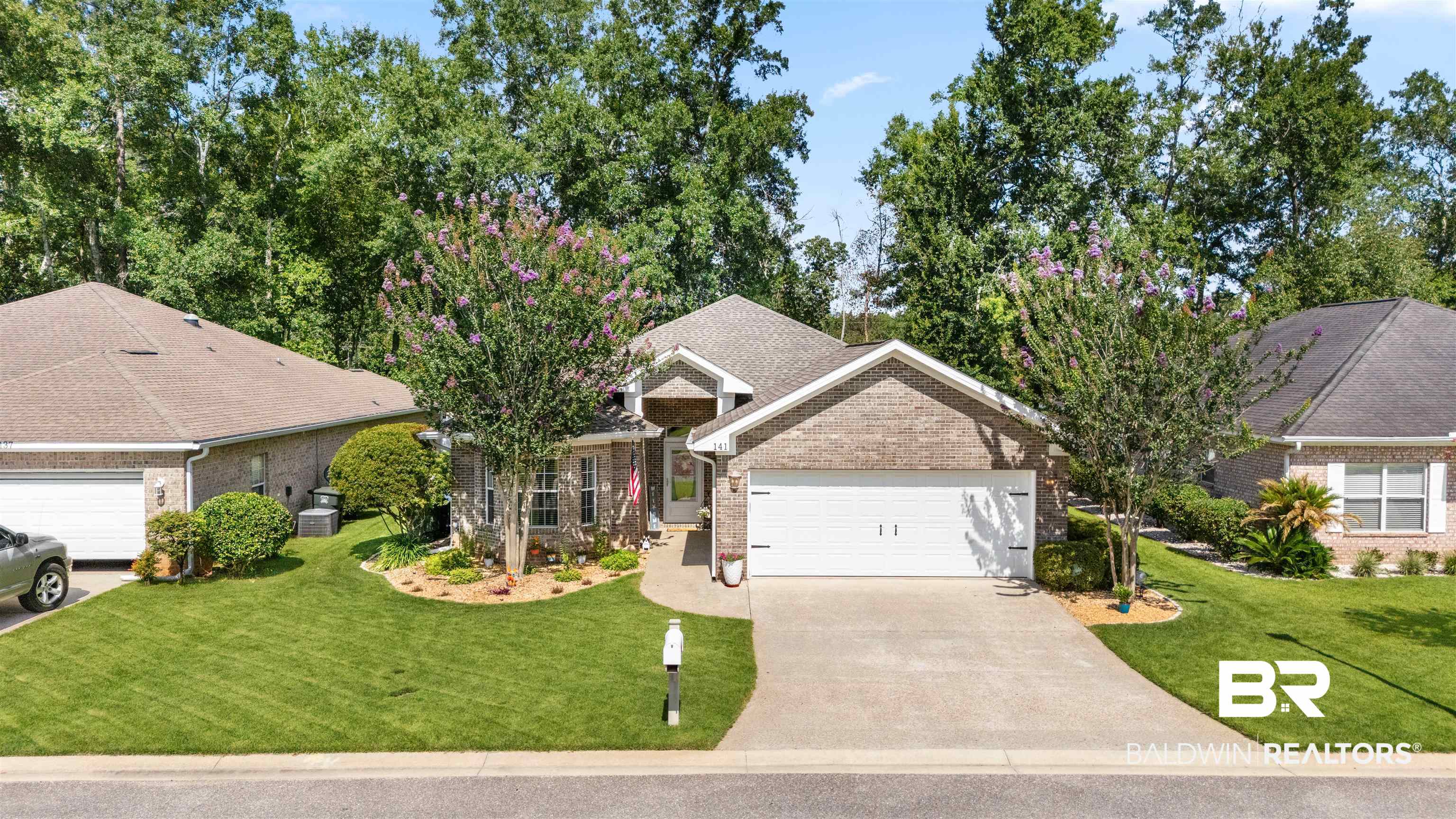 141 Mark Twain Loop Foley, AL 36535 - Photo 47 of 55 Ranch-style home with a garage, driveway, brick siding, and a front lawn