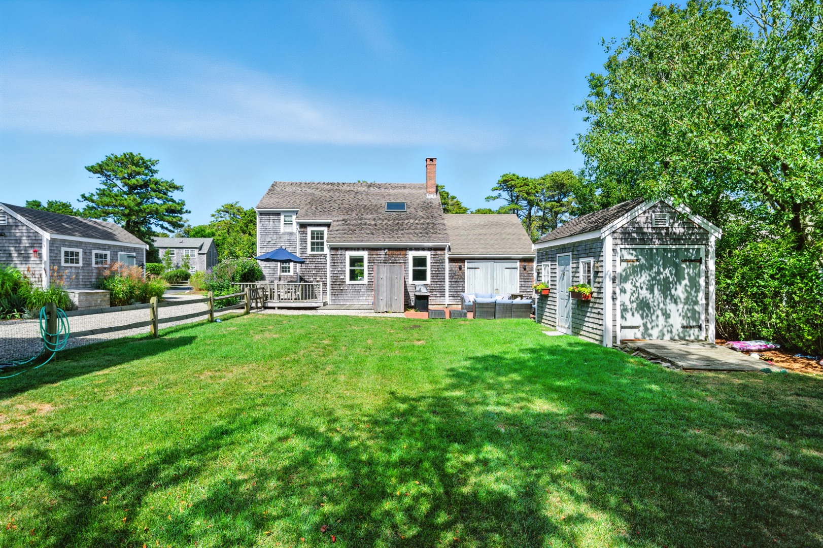 2 The Grove Nantucket, MA 02554 - Photo 2 of 33 a view of a house with backyard and a sitting area