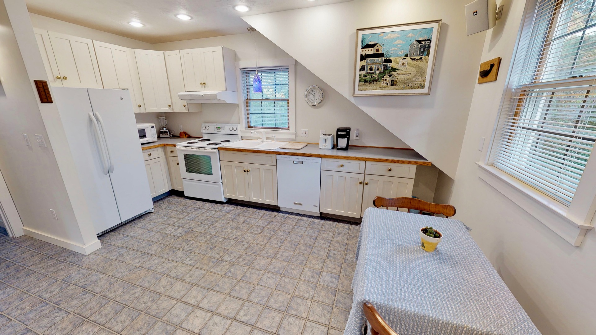 2 The Grove Nantucket, MA 02554 - Photo 29 of 33 a kitchen with white cabinets and white appliances