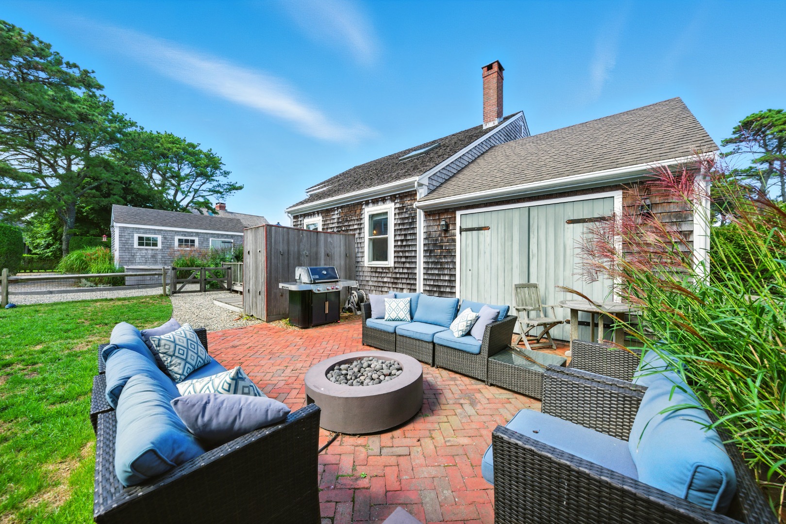 2 The Grove Nantucket, MA 02554 - Photo 5 of 33 a outdoor space with patio couches and a potted plant