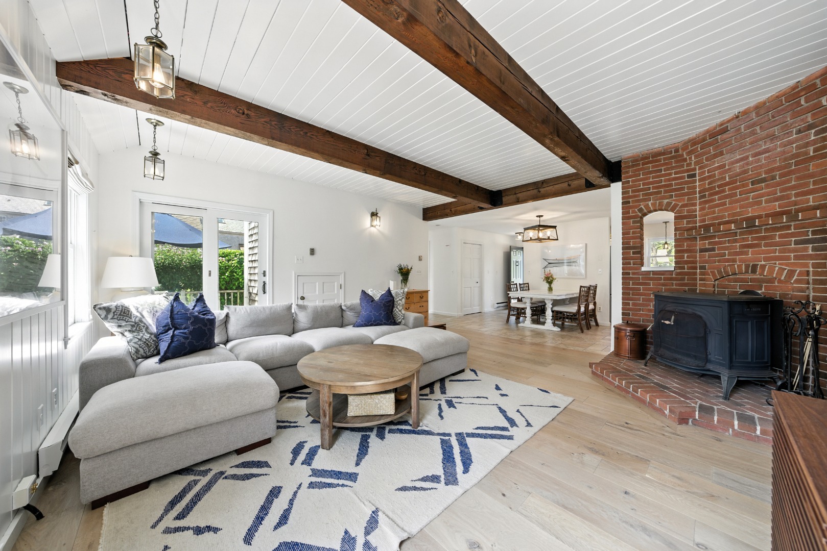 2 The Grove Nantucket, MA 02554 - Photo 9 of 33 a living room with patio furniture and a wooden floor