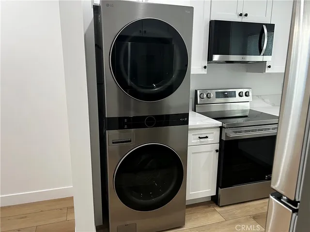 a kitchen with a stove and a microwave