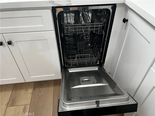 a white refrigerator freezer sitting in a kitchen