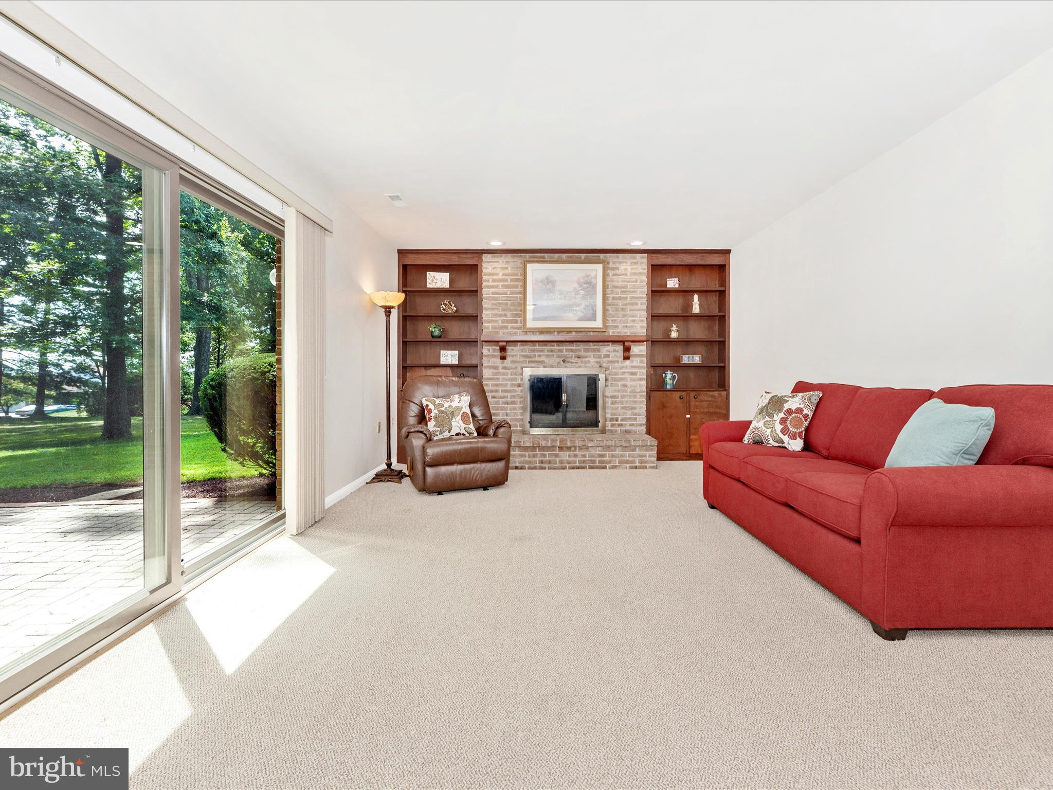 5018 Camelback Lane Frederick, MD 21703 - Photo 16 of 41 a living room with furniture and a floor to ceiling window