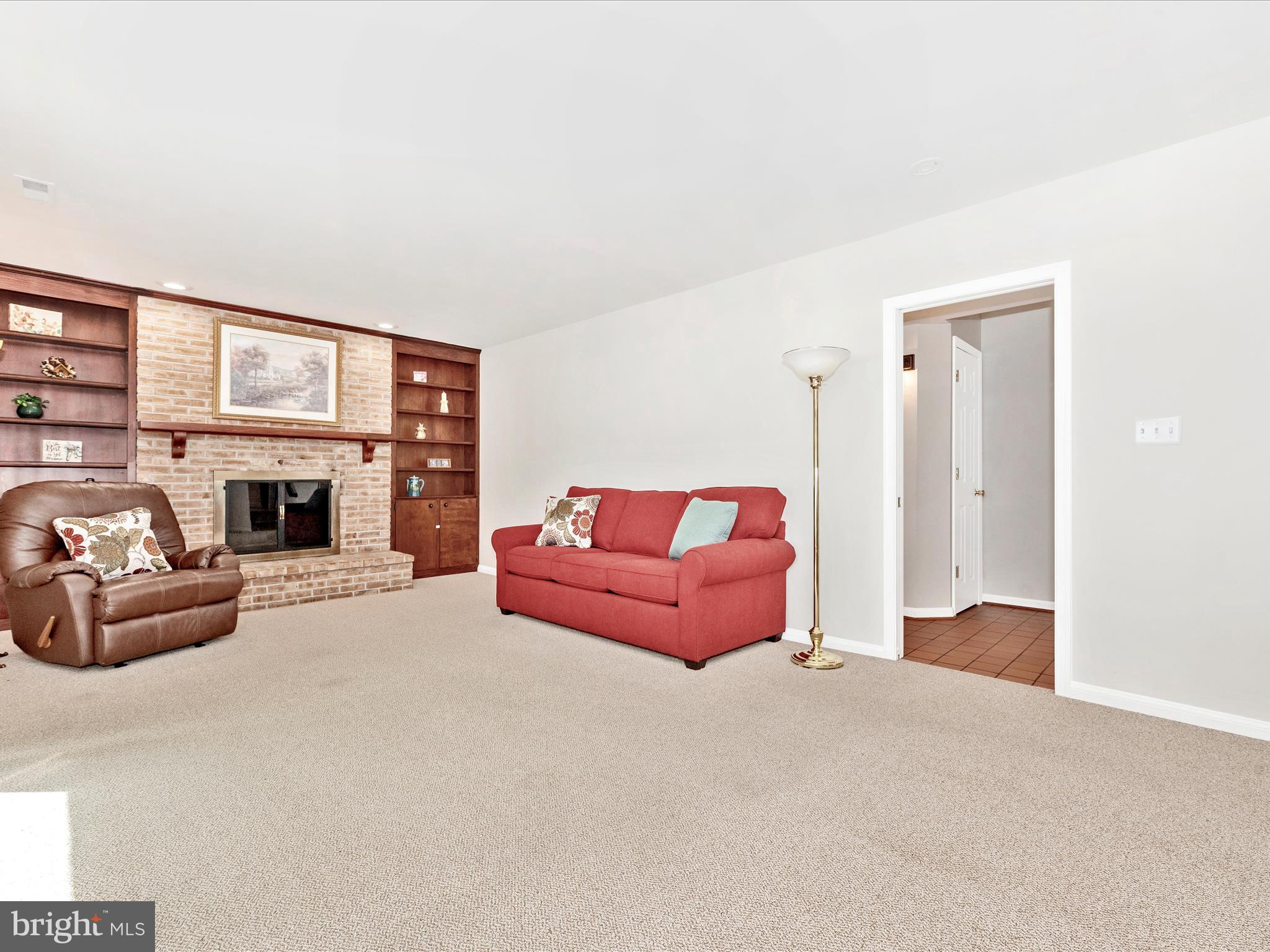 5018 Camelback Lane Frederick, MD 21703 - Photo 17 of 41 a living room with furniture and a fireplace