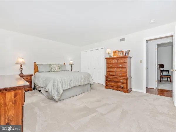 a bedroom with a bed and a cabinets