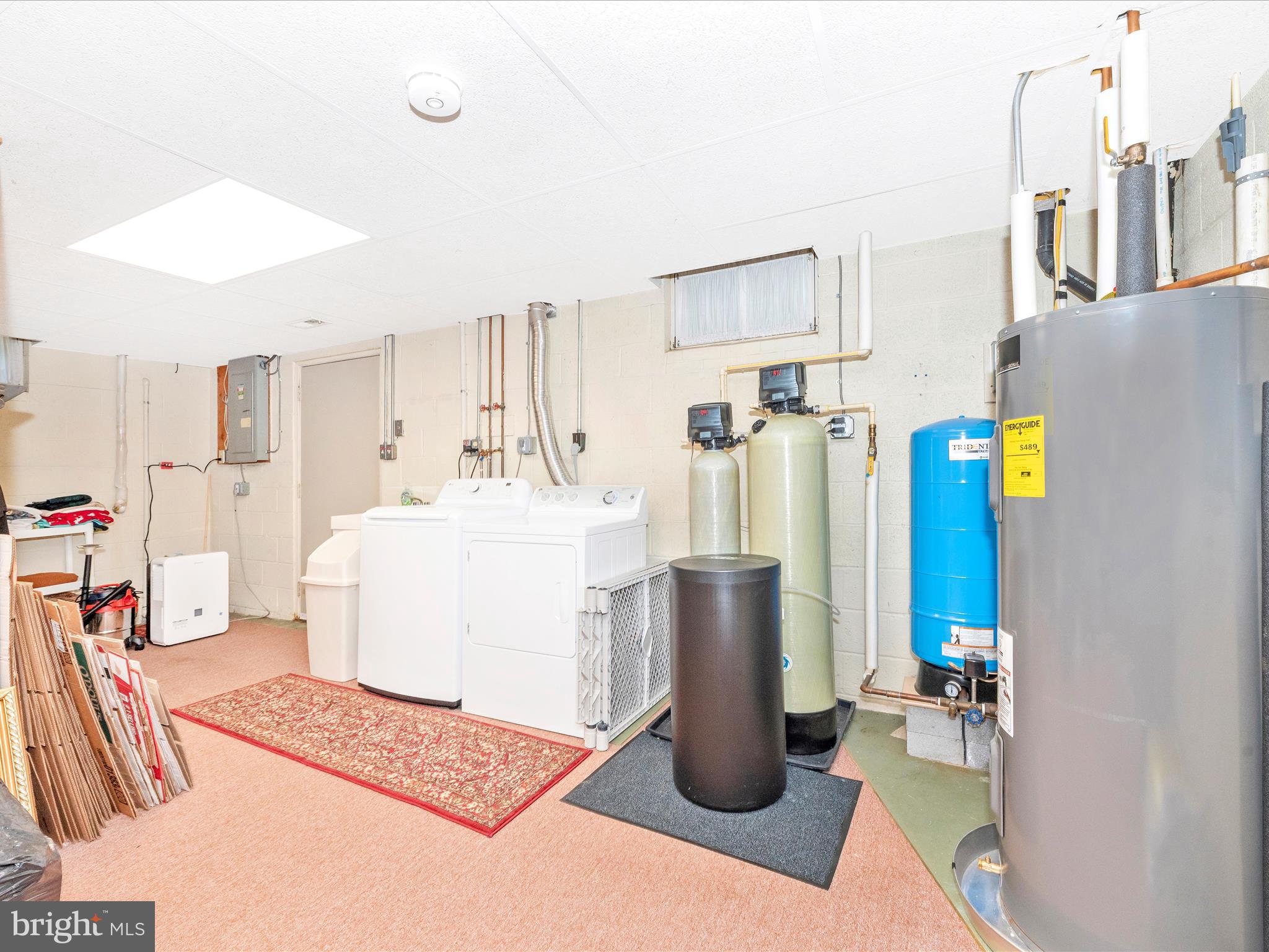 5018 Camelback Lane Frederick, MD 21703 - Photo 28 of 41 a living room with furniture a dining table and a refrigerator