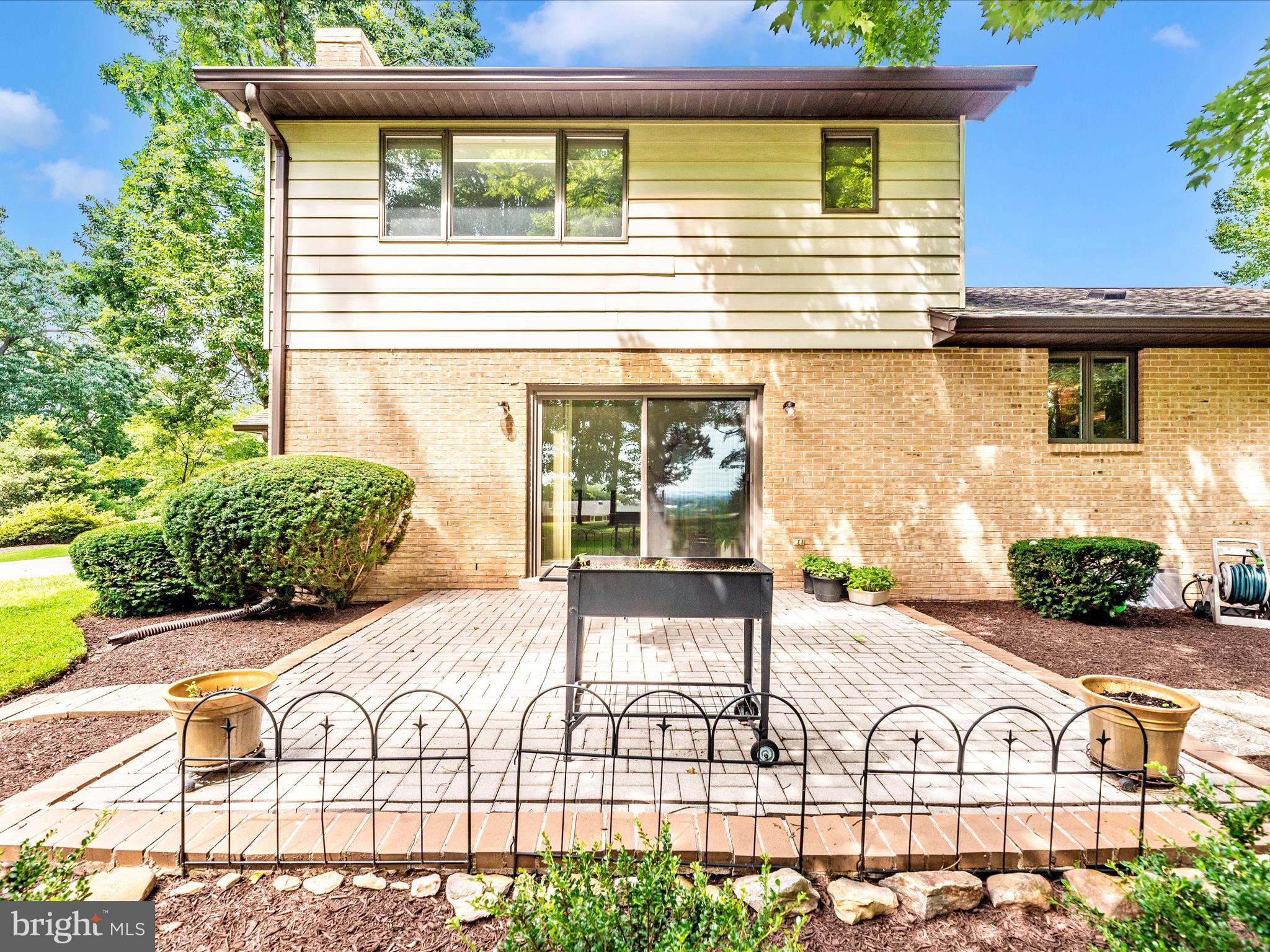 5018 Camelback Lane Frederick, MD 21703 - Photo 30 of 41 a view of a brick house with many windows