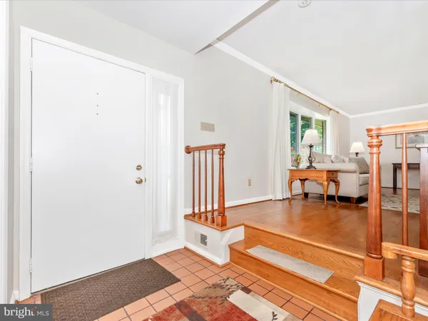 a room with pool table and glass door