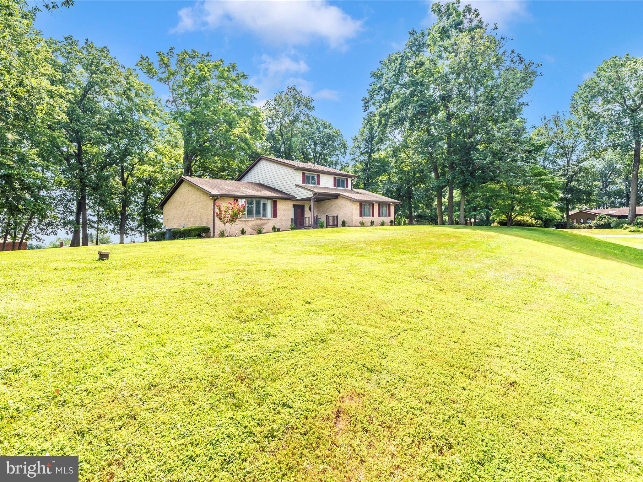 5018 Camelback Lane Frederick, MD 21703 - Photo 37 of 41 a view of a swimming pool with lawn chairs and plants