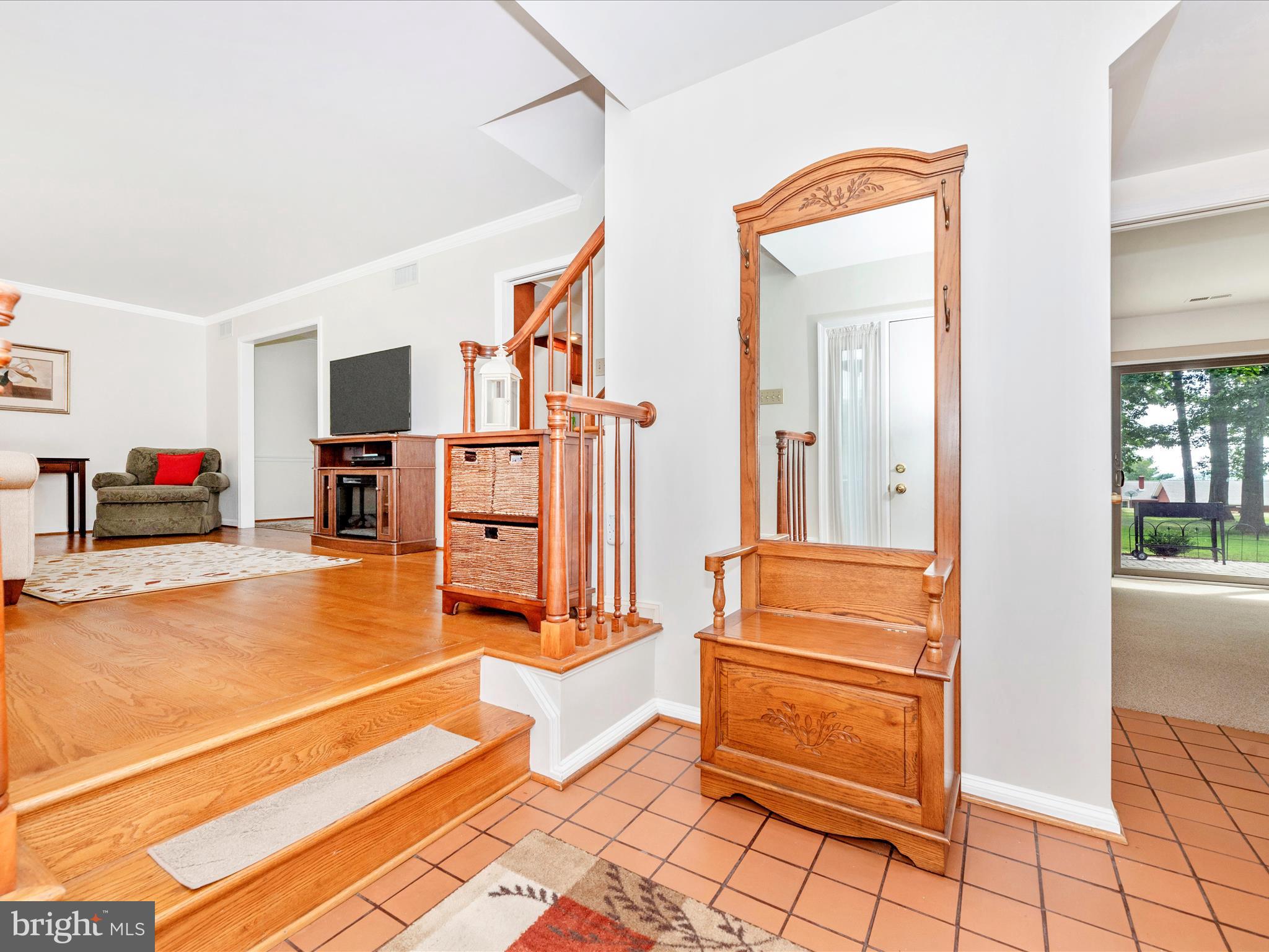 5018 Camelback Lane Frederick, MD 21703 - Photo 4 of 41 a living room with furniture and a flat screen tv