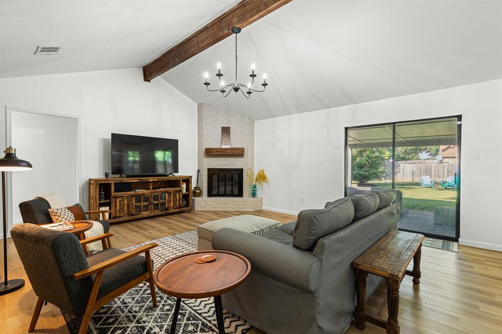 116 Marylee Drive Hewitt, TX 76643 - Photo 5 of 21 a living room with furniture a fireplace and a flat screen tv