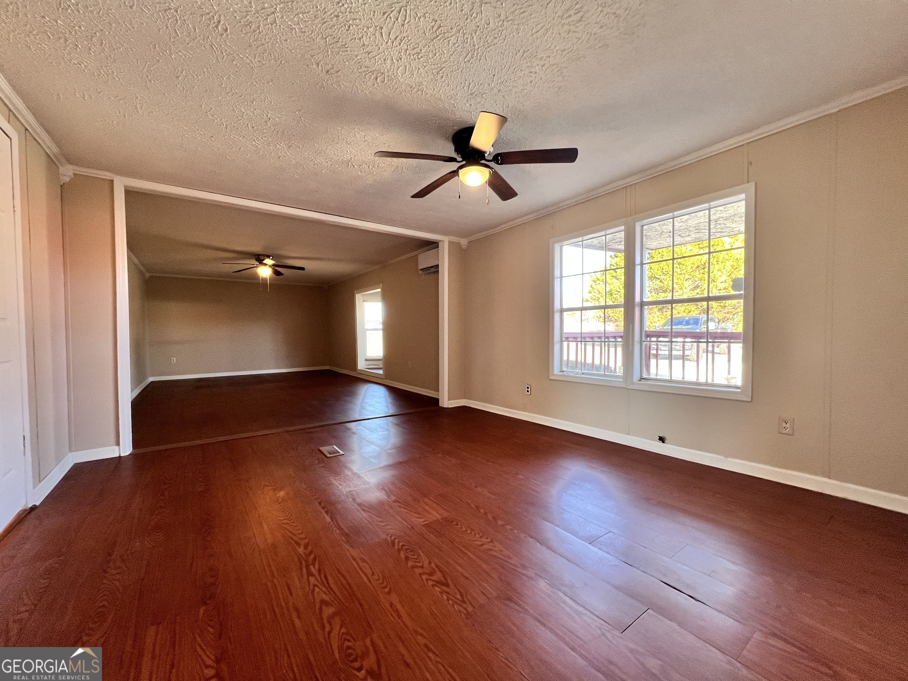 103 Henderson Springs Road Elko, GA 31025 - Photo 12 of 33 a view of empty room with wooden floor and fan