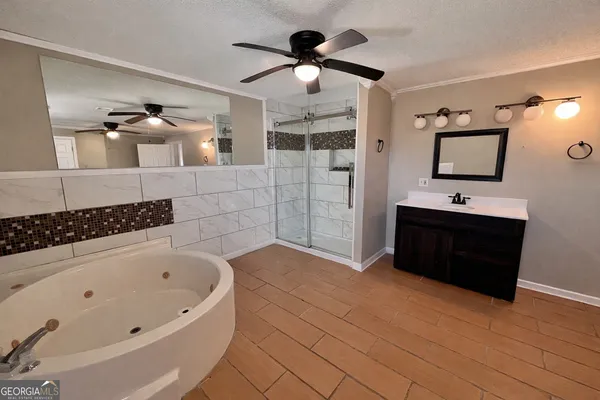 a bathroom with a bathtub and a shower