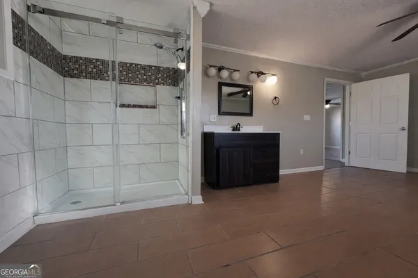 a bathroom with a bathtub and a shower