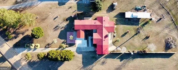 an aerial view of residential houses with outdoor space