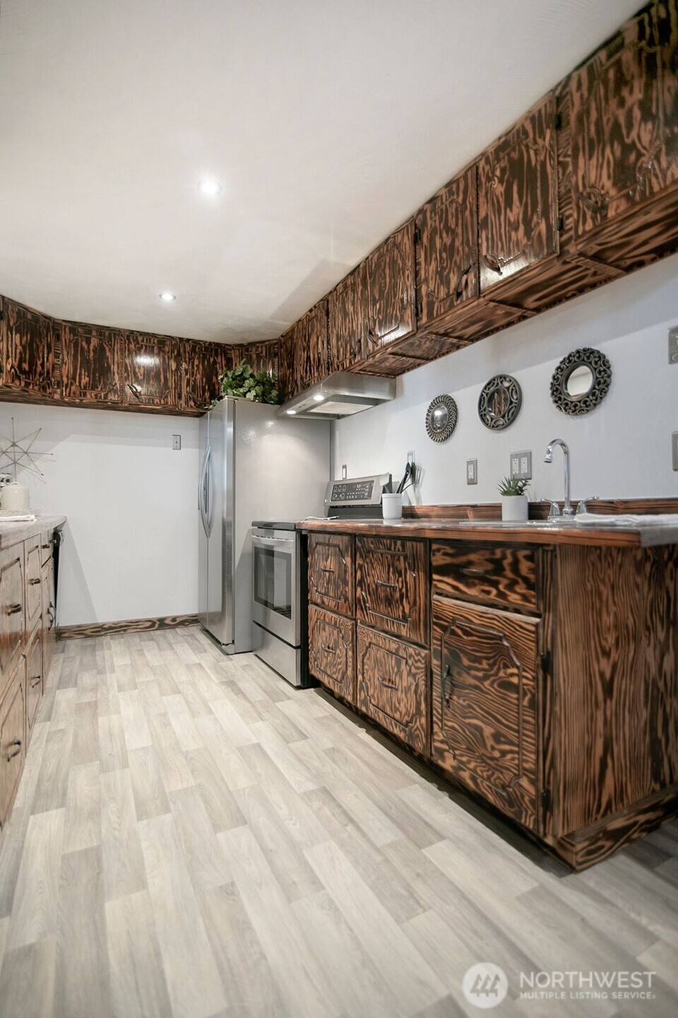 140 Rodgers Road Silverlake, WA 98645 - Photo 12 of 35 a kitchen with stainless steel appliances granite countertop a sink and cabinets