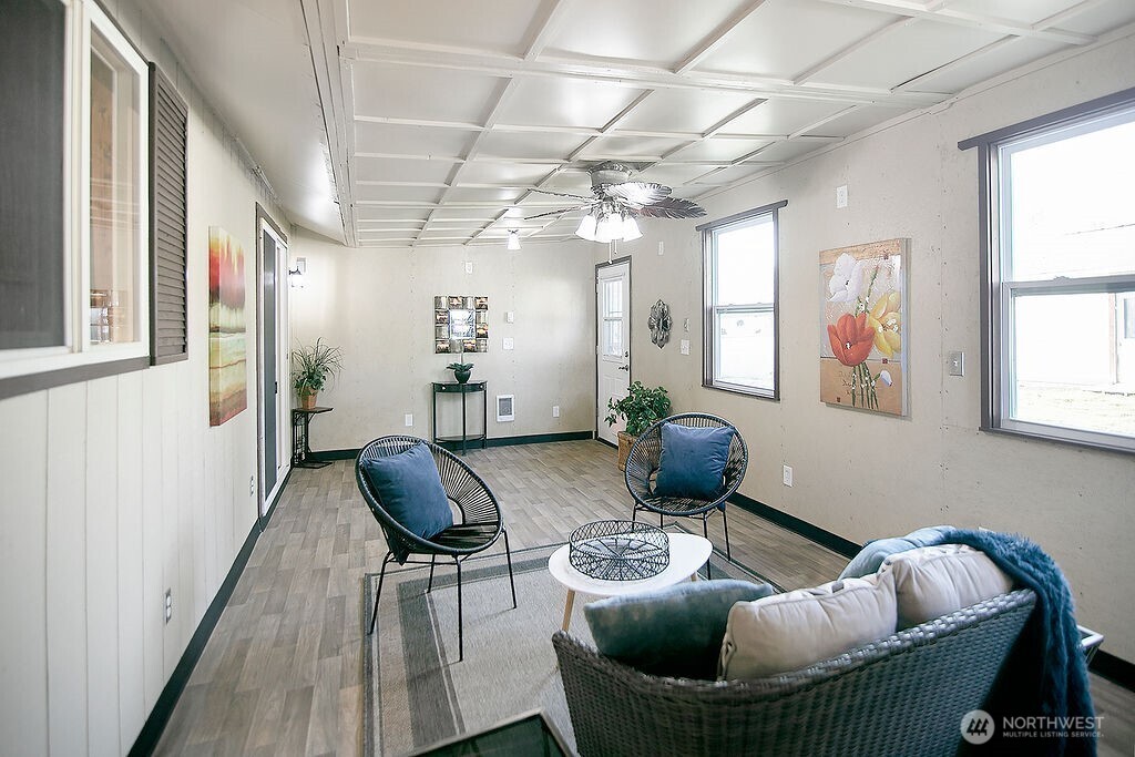 140 Rodgers Road Silverlake, WA 98645 - Photo 16 of 35 a living room with furniture and wooden floor