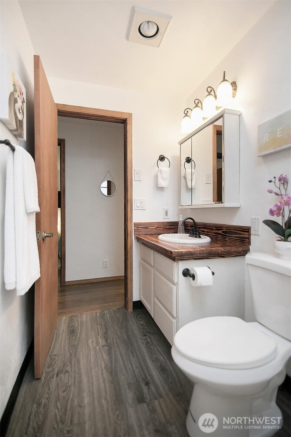 140 Rodgers Road Silverlake, WA 98645 - Photo 26 of 35 a bathroom with a double vanity sink toilet and mirror