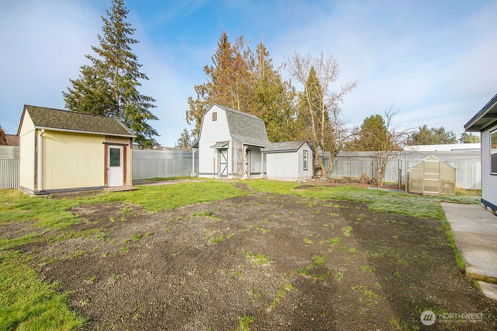 140 Rodgers Road Silverlake, WA 98645 - Photo 29 of 35 a view of a house with backyard and tree s