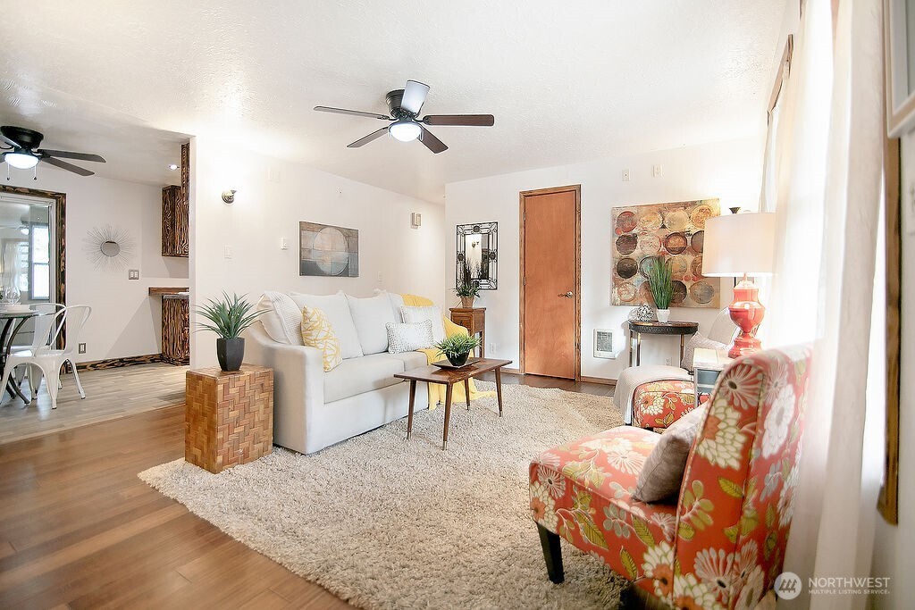 140 Rodgers Road Silverlake, WA 98645 - Photo 3 of 35 a living room with furniture and a wooden floor