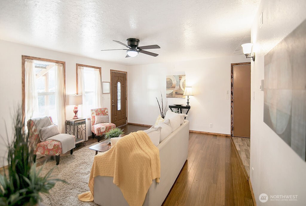 140 Rodgers Road Silverlake, WA 98645 - Photo 5 of 35 a living room with furniture and a large window