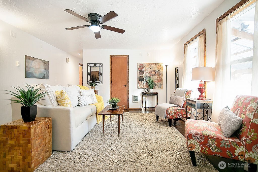 140 Rodgers Road Silverlake, WA 98645 - Photo 6 of 35 a living room with furniture and a large window