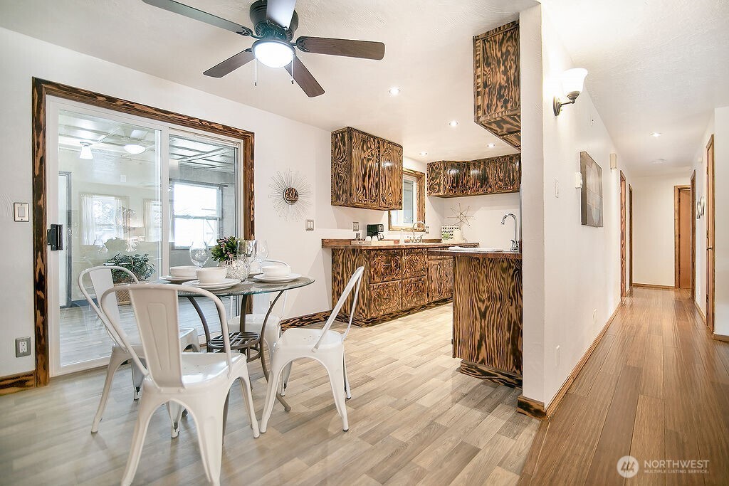 140 Rodgers Road Silverlake, WA 98645 - Photo 8 of 35 a view of a dining room with furniture and wooden floor