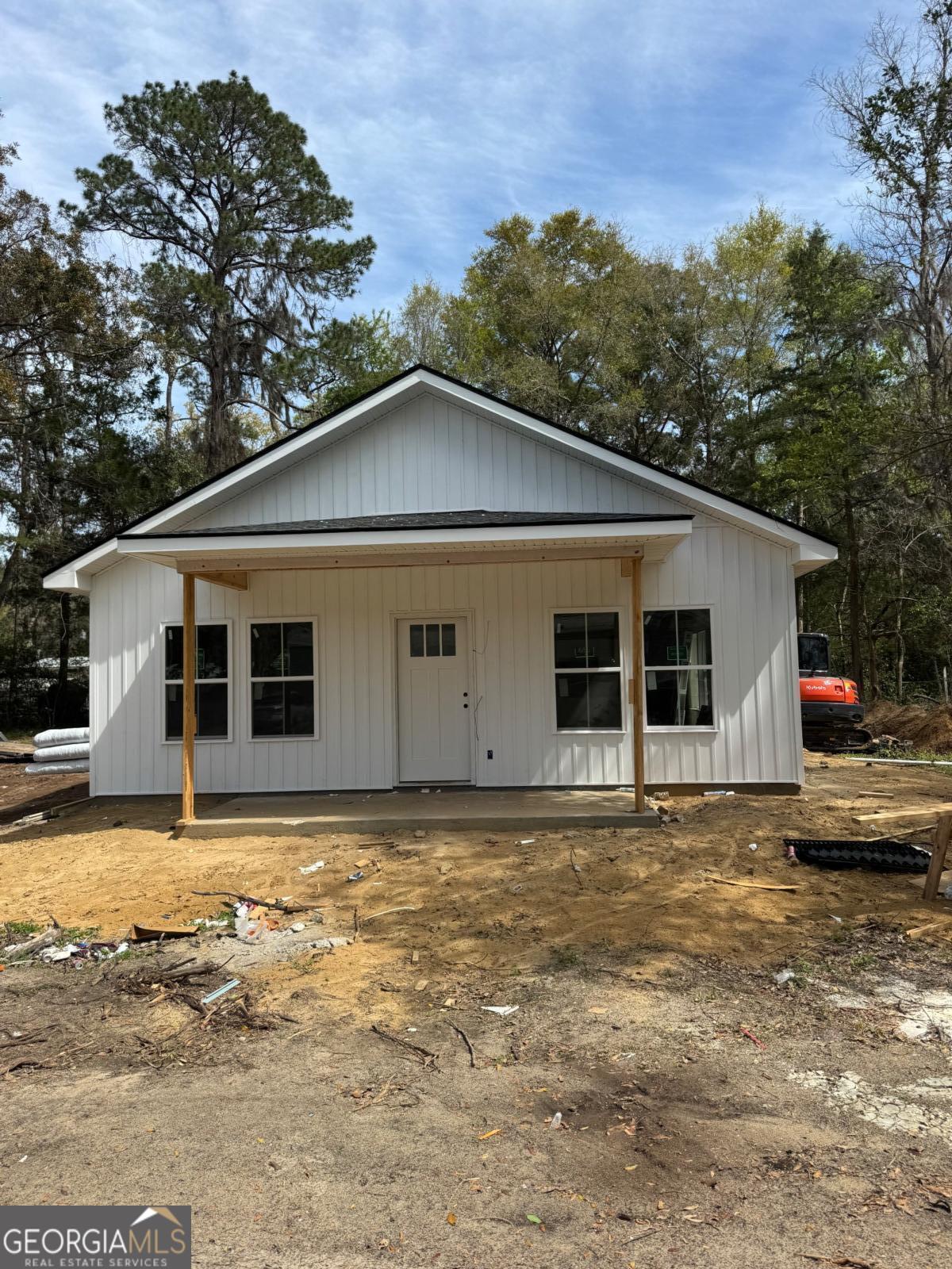 a big house with trees in the background