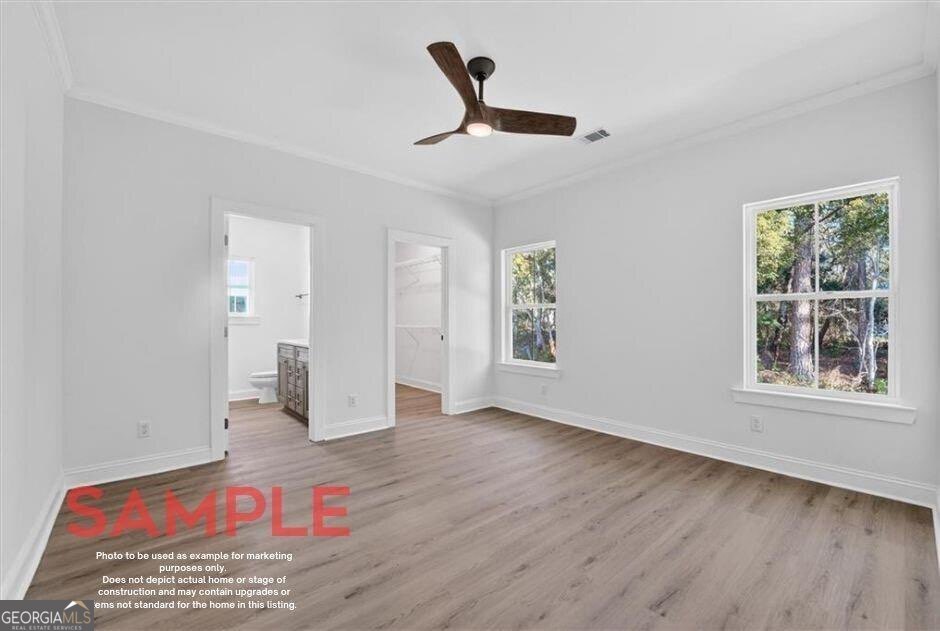 14 Casey Road Northeast Townsend, GA 31331 - Photo 6 of 12 a view of an empty room with a window and wooden floor