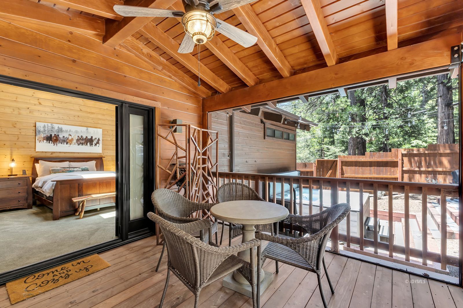 24924 Fern Valley Road Idyllwild, CA 92549 - Photo 14 of 72 a view of a patio with table and chairs and potted plants