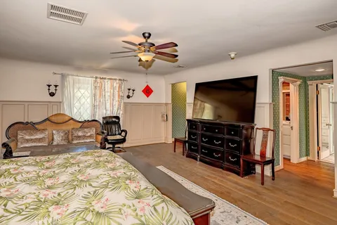 a living room filled with furniture and a gate